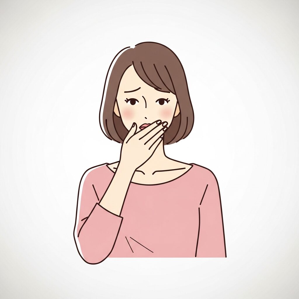匂いが気になり手で口元をおさえる女性